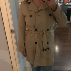 Double breasted beige trench coat